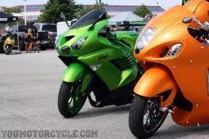 Slammed and stretched ZX-14 and Hayabusa with models in the background