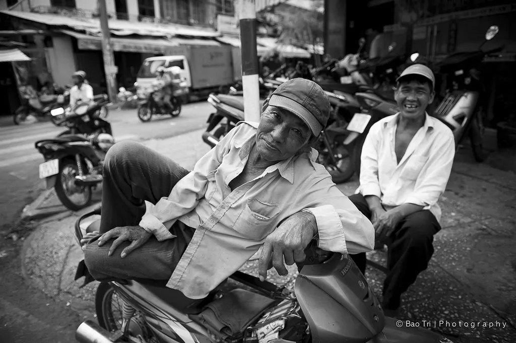A Motorcycle Taxi rider in Chinatown Sai gon Viet Nam