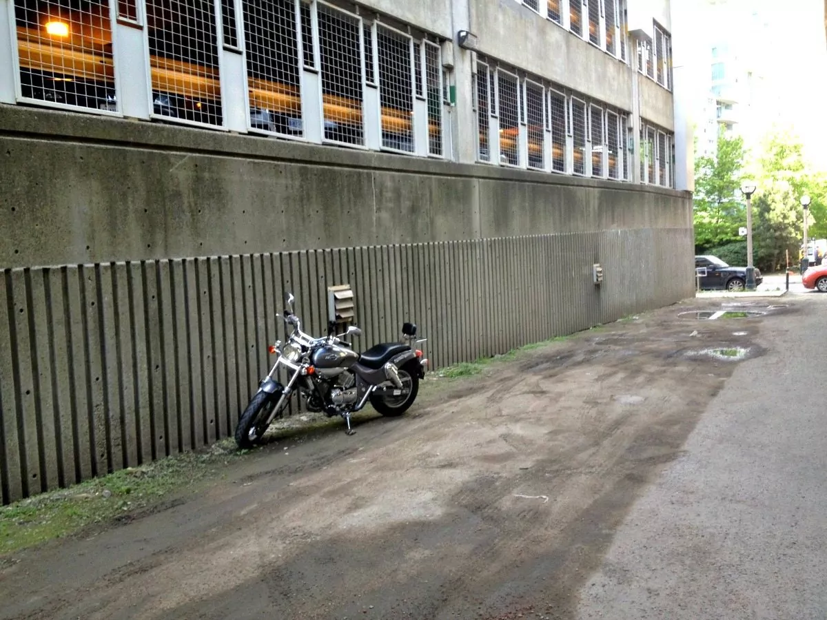 Downtown Toronto motorcycle parking behind a parking lot