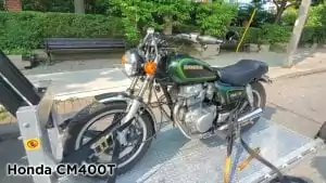 Honda CM400T being picked up by Motorcycle Towing Toronto