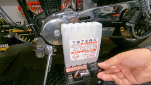 Filling a motorcycle battery with acid. The mic is recording the sounds of the acid bubbling.