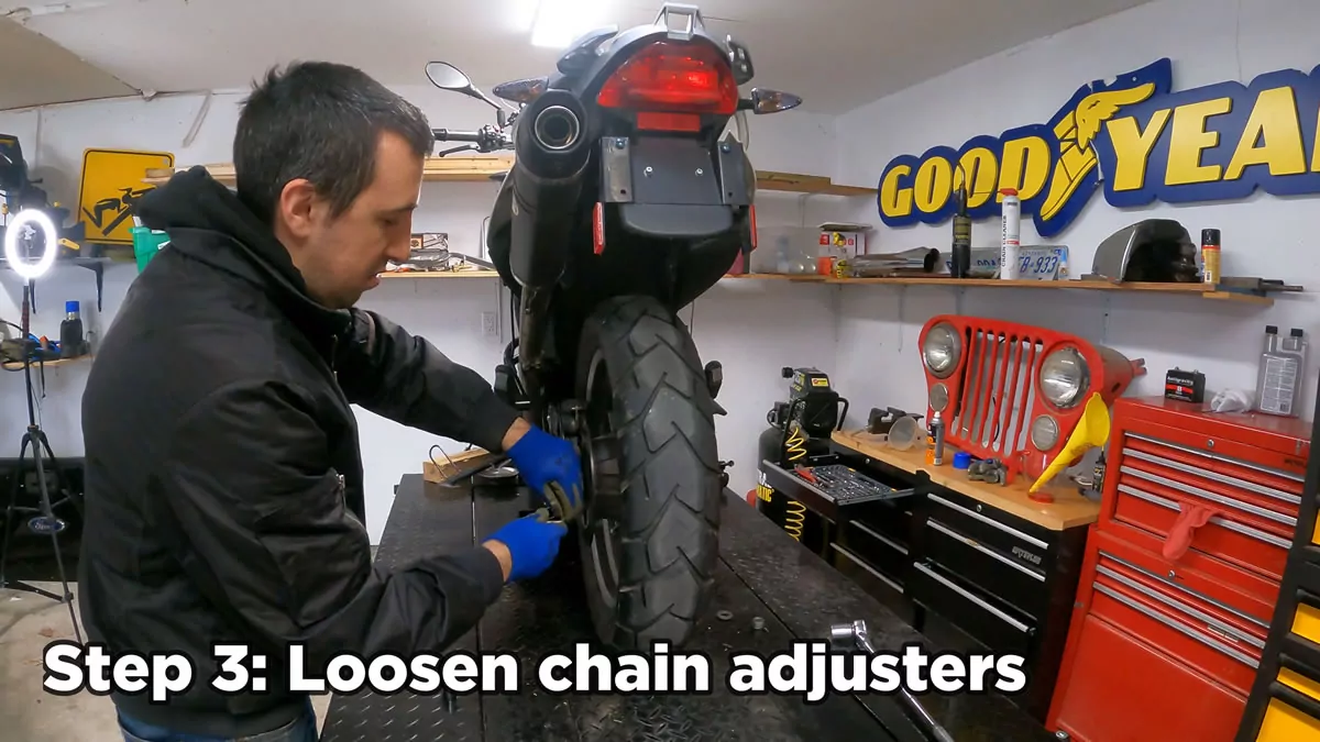 how to remove rear motorcycle wheel - loosen chain adjusters