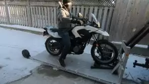loading motorcycle on platform