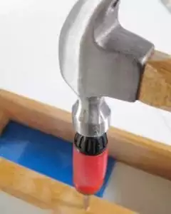 Stripped screw head extraction with a hammer